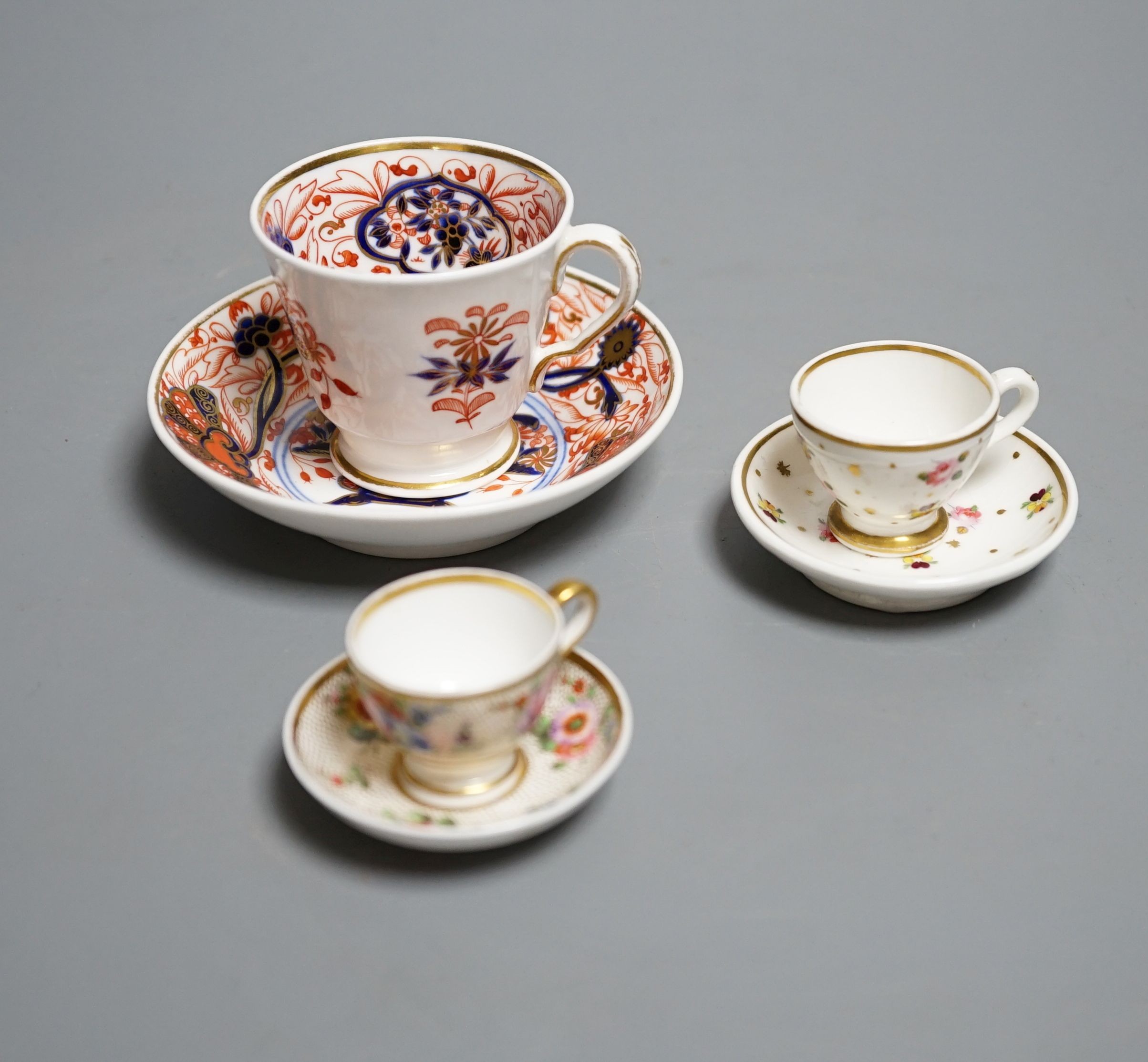 Three Spode miniature teacups and saucers, c.1815. Provenance - Mona Sattin collection of miniature cups and saucers, collection no.s 120, 121 & 130.